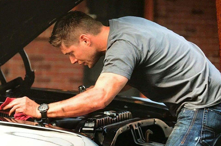 Dean Winchester fixing a car